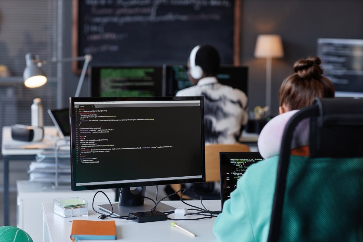 Technology professionals monitoring real-time data and analytics dashboards using Elasticsearch and Kibana